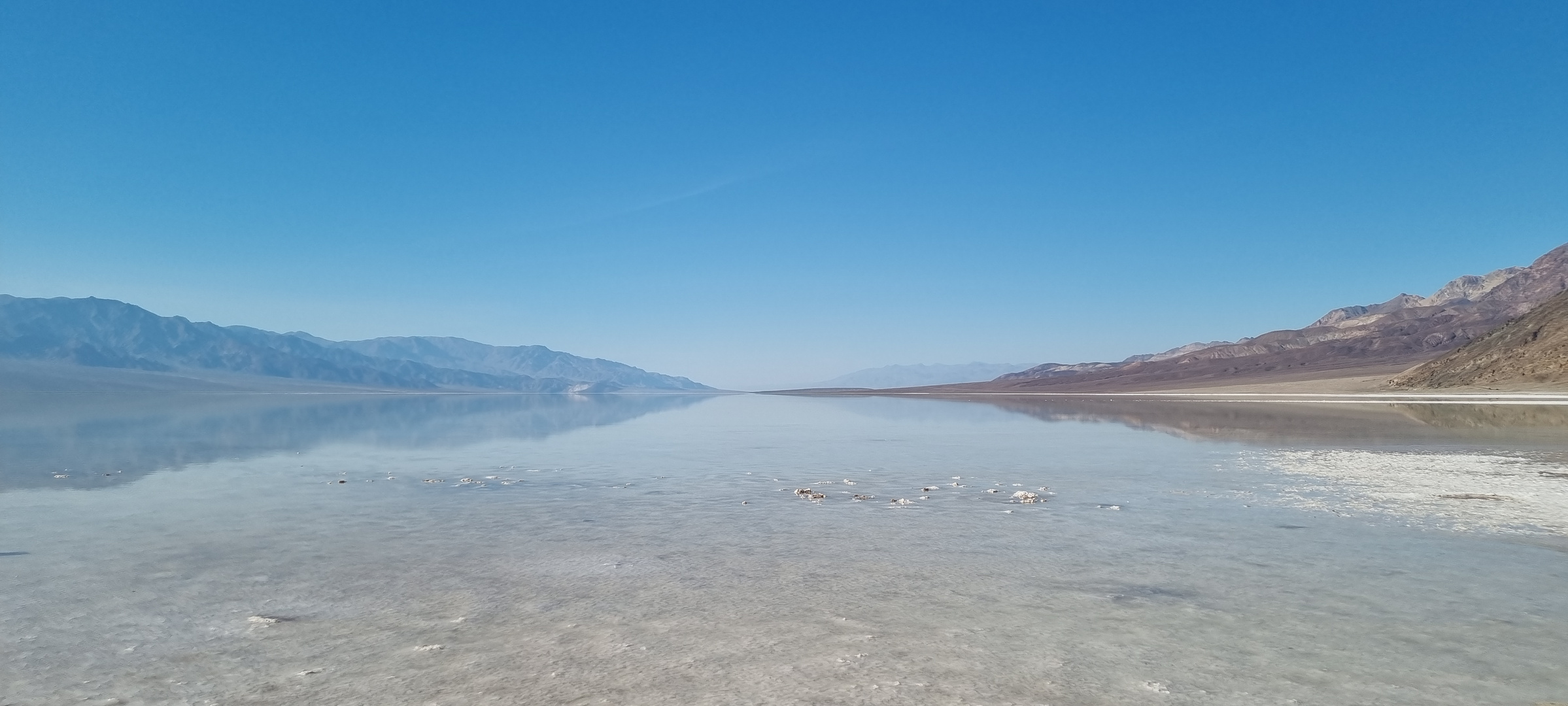 Reflections in the lake at Badwater Basin / Death Valley