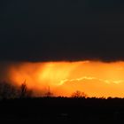 Regen trifft Sonnenuntergang 