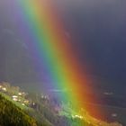 Regenbogen in den Bergen