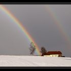 Regenbogen in Winterlandschaft