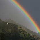 Regenbogen über den Chiemgauer Bergen