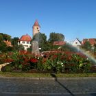 Regenbogen über Kreiselbepflanzung  in Dinkelsbühl