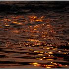 Riflessi di un tranquillo tramonto sulle acque del torrente..