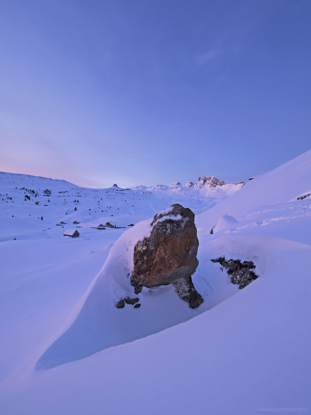 rock in deep snow