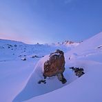 rock in deep snow