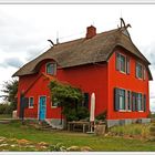 Rotes Haus am Meer