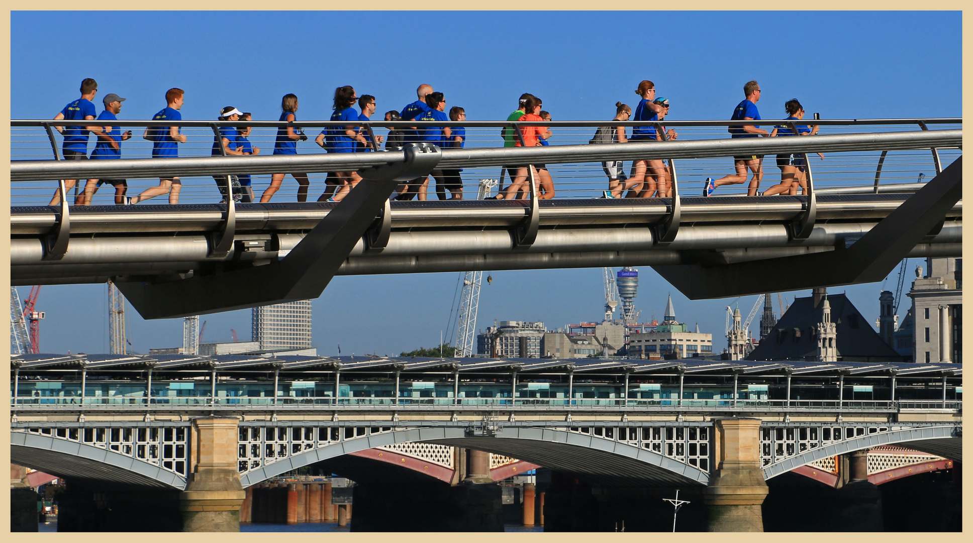 runners on the millennium bridge London