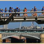 runners on the millennium bridge London