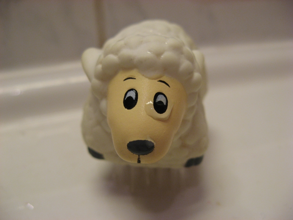 sad sheep in bathroom