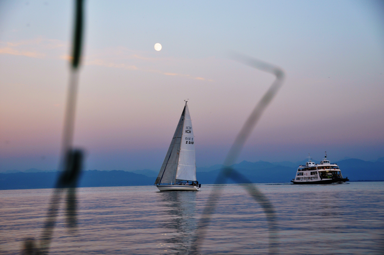 Sailing boat under the moon