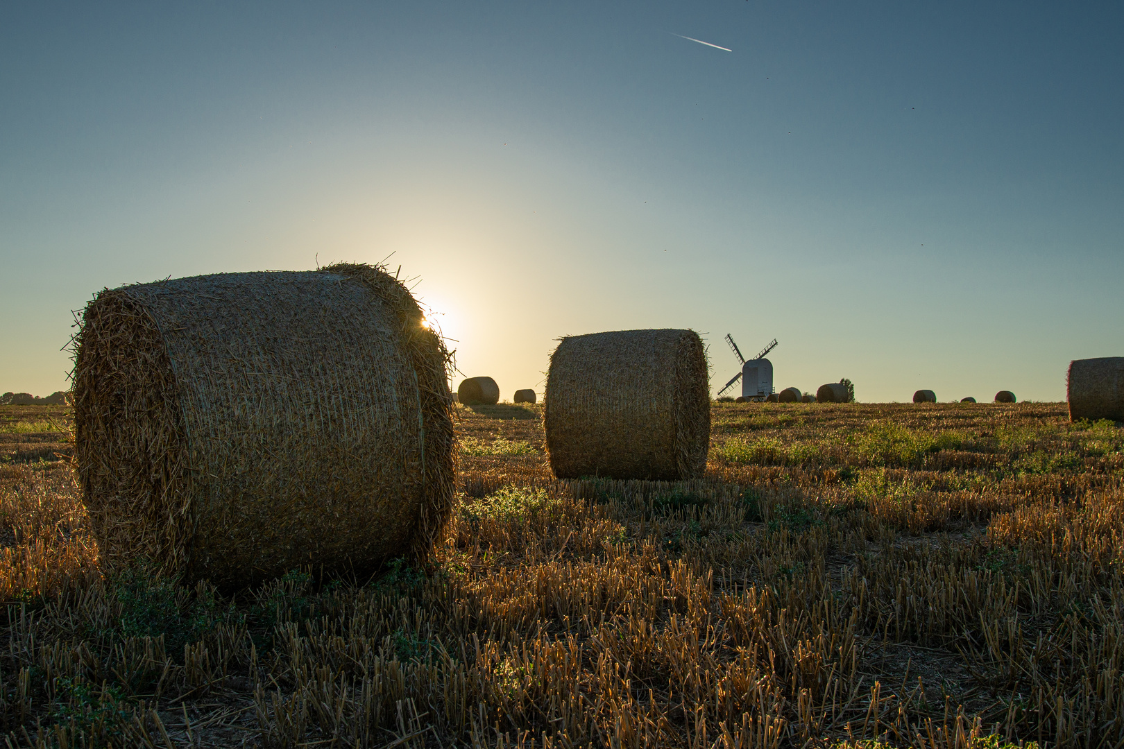 Sails and Bales at Sunset.