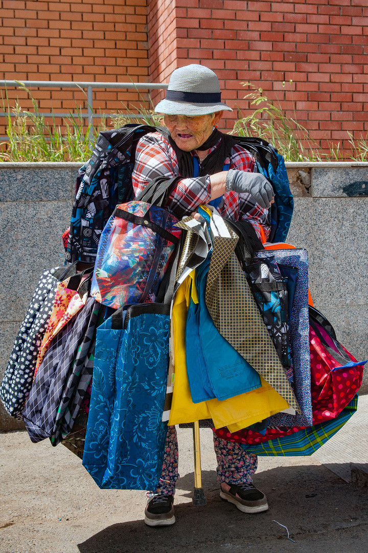 Saleswoman in front of the shopping mall