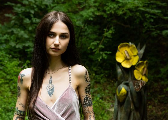 Sana by the Sculpture