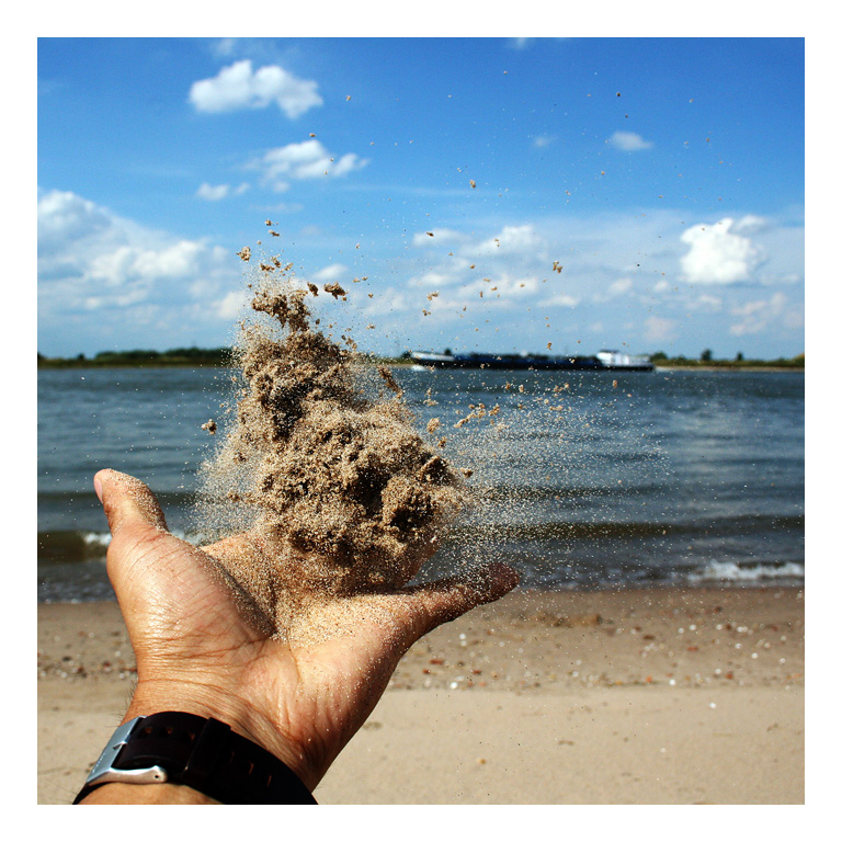 Sand and hand, frozen in time