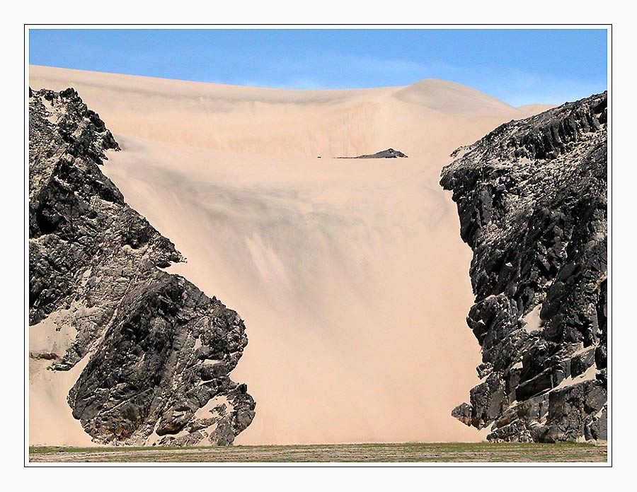 sand dune eats rocks ......