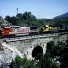 Santa Fe AT&SF #894 red Warbonnet leading a Freight Train...