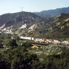 Santa Fe ATSF/BNSF red wb Locos are pulling a Trailer Train close to Rte.66,No.2,CA