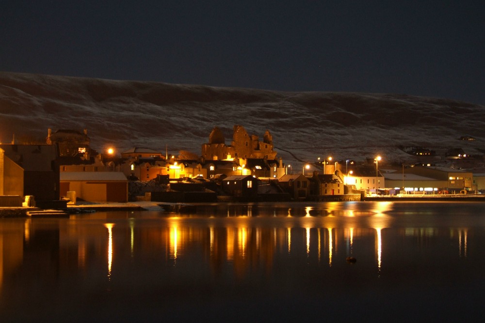 Scalloway castle and harbour at night