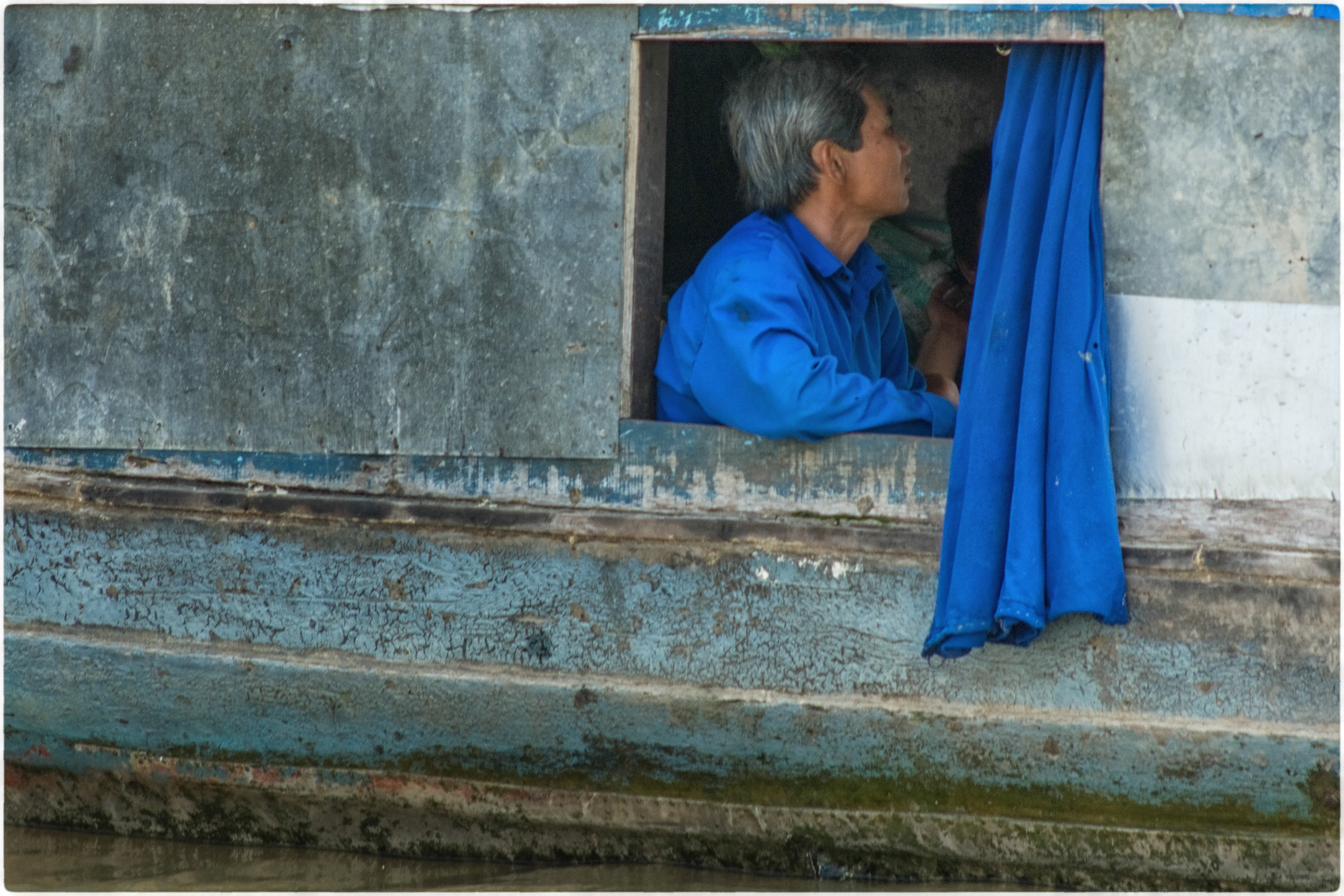 Schiffer auf dem Mekong