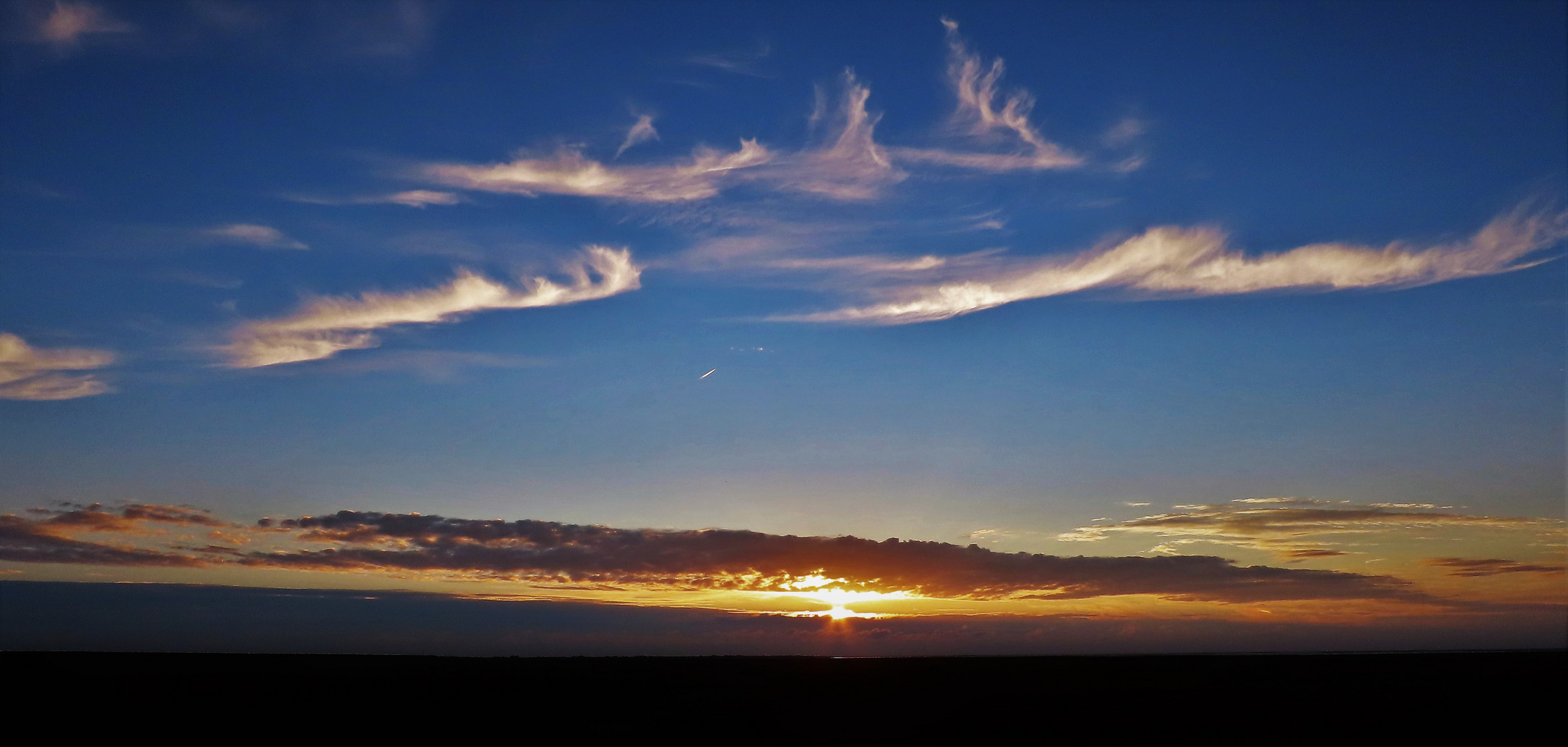 Schleierwolken mit Sonne