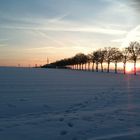 Schneelandschaft mit Sonnenuntergang