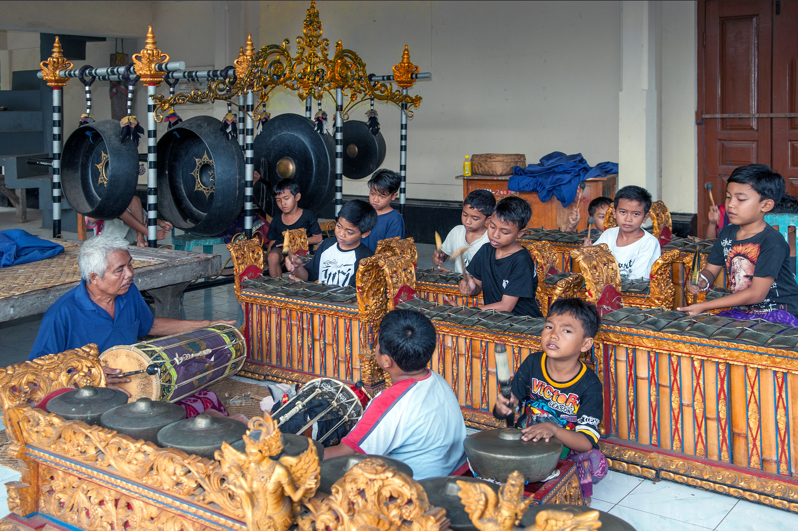 Schoolboys learning Gamelan music