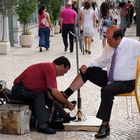 "Schuhputzer in den Strassen von Lissabon"