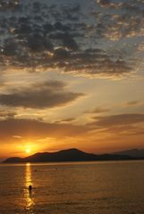 Schwimmen bei Sonnenuntergang