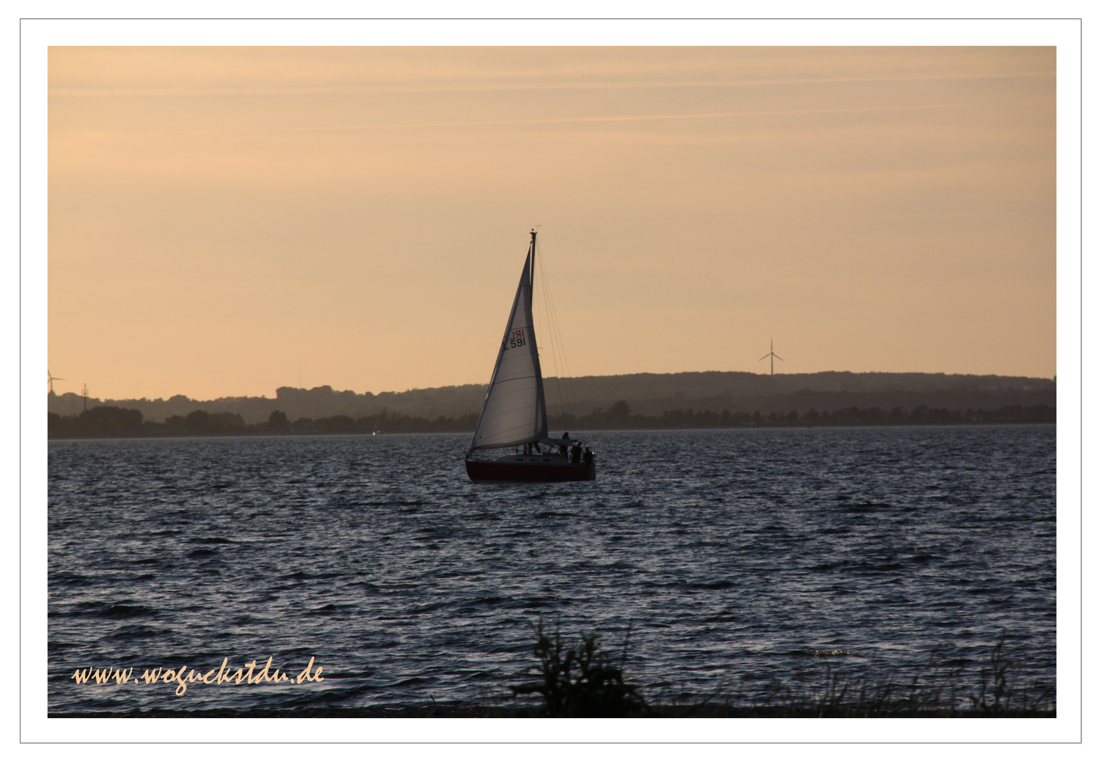 Segelschiff im Sonnenuntergang auf der Förde bei Langballig Au