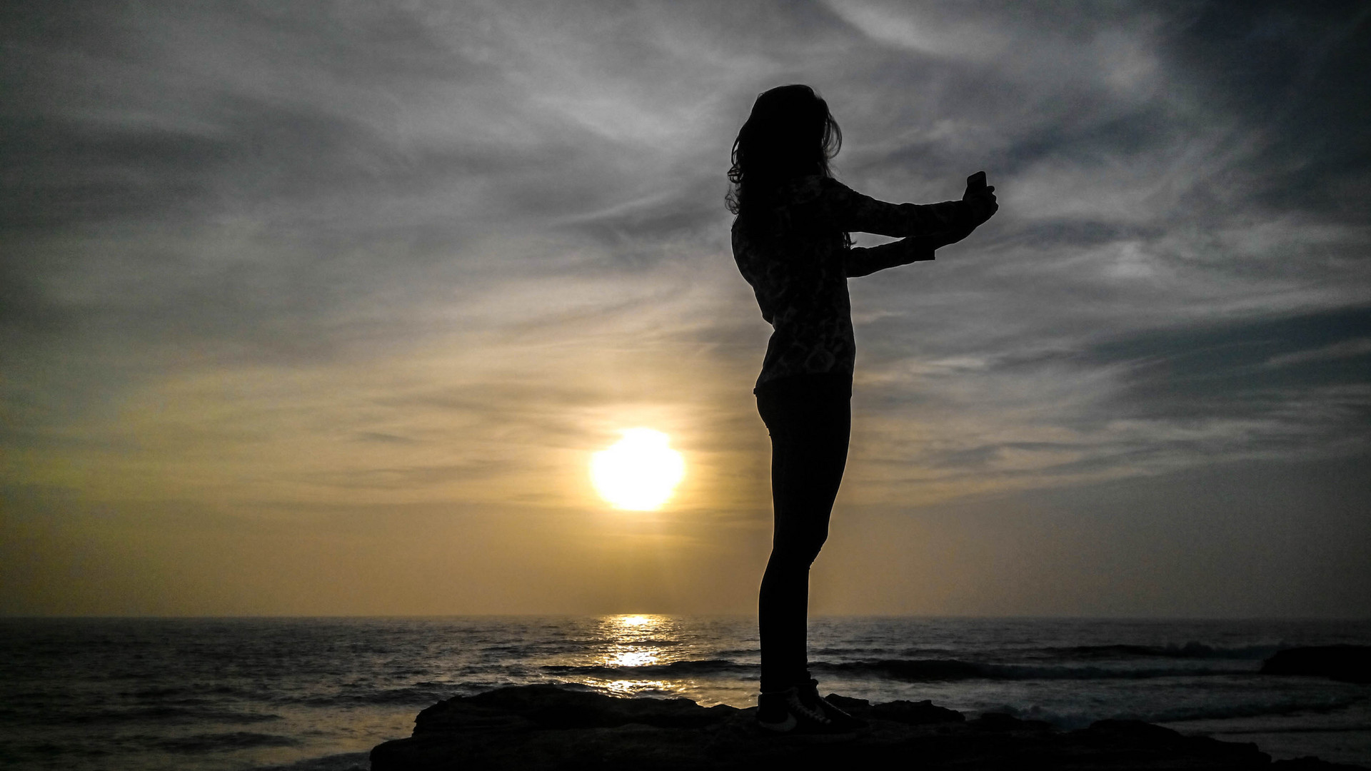 Selfie girl on sunset