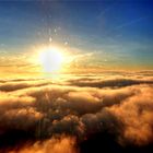 SETTING SUN ABOVE THE CLOUDS
