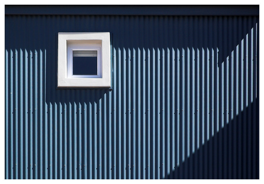 shadows on grey-blue wall