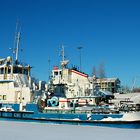 Ships stuck on the frozen Belaya river