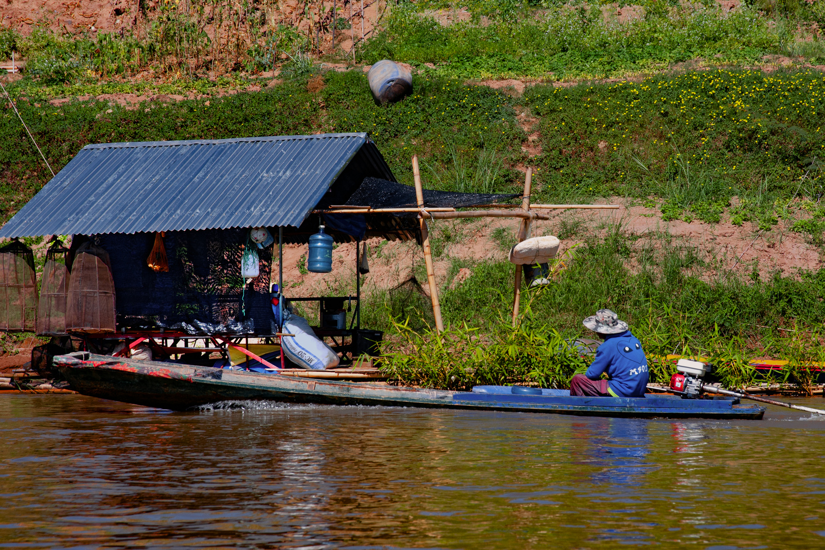 Simple housing at Laotian river side