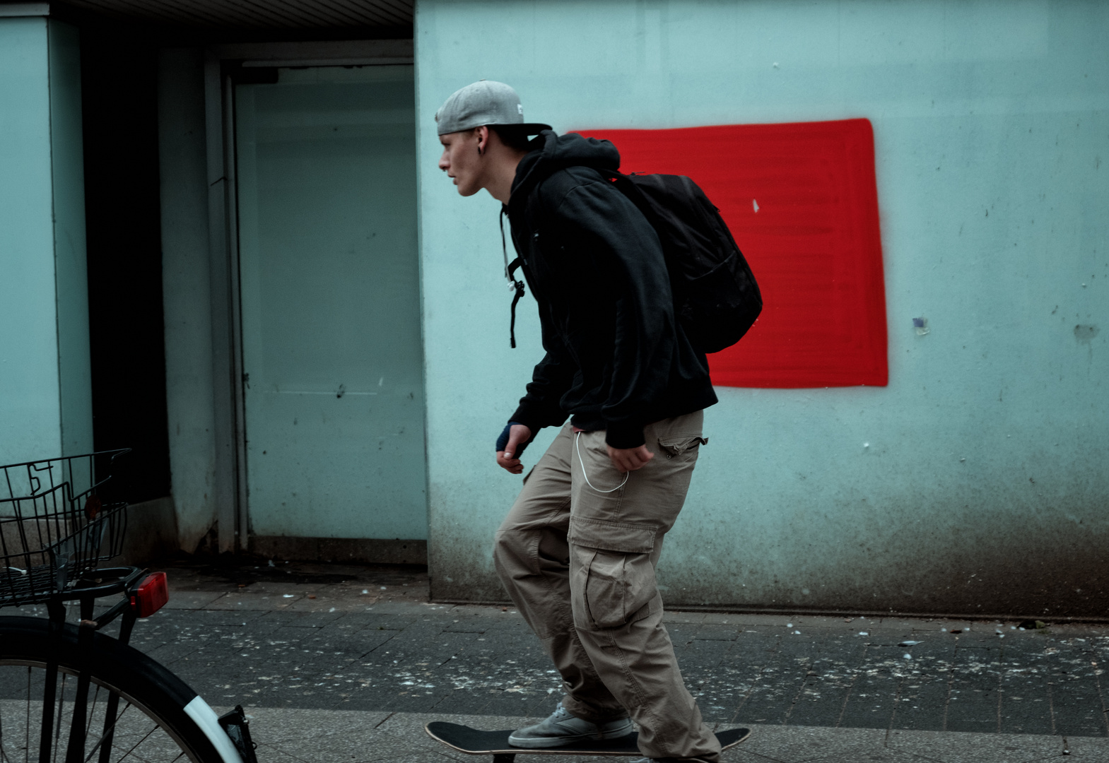 Skater in front of red