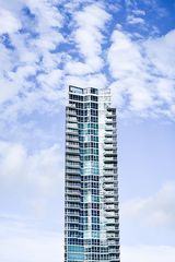 skyscraper with blue sky and clouds