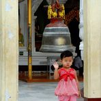 Small boy ringing small bell