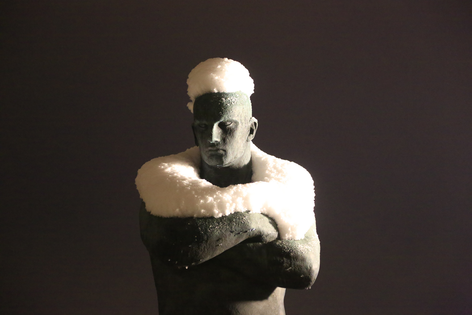 Snowfall on sculpture in the Vigeland park