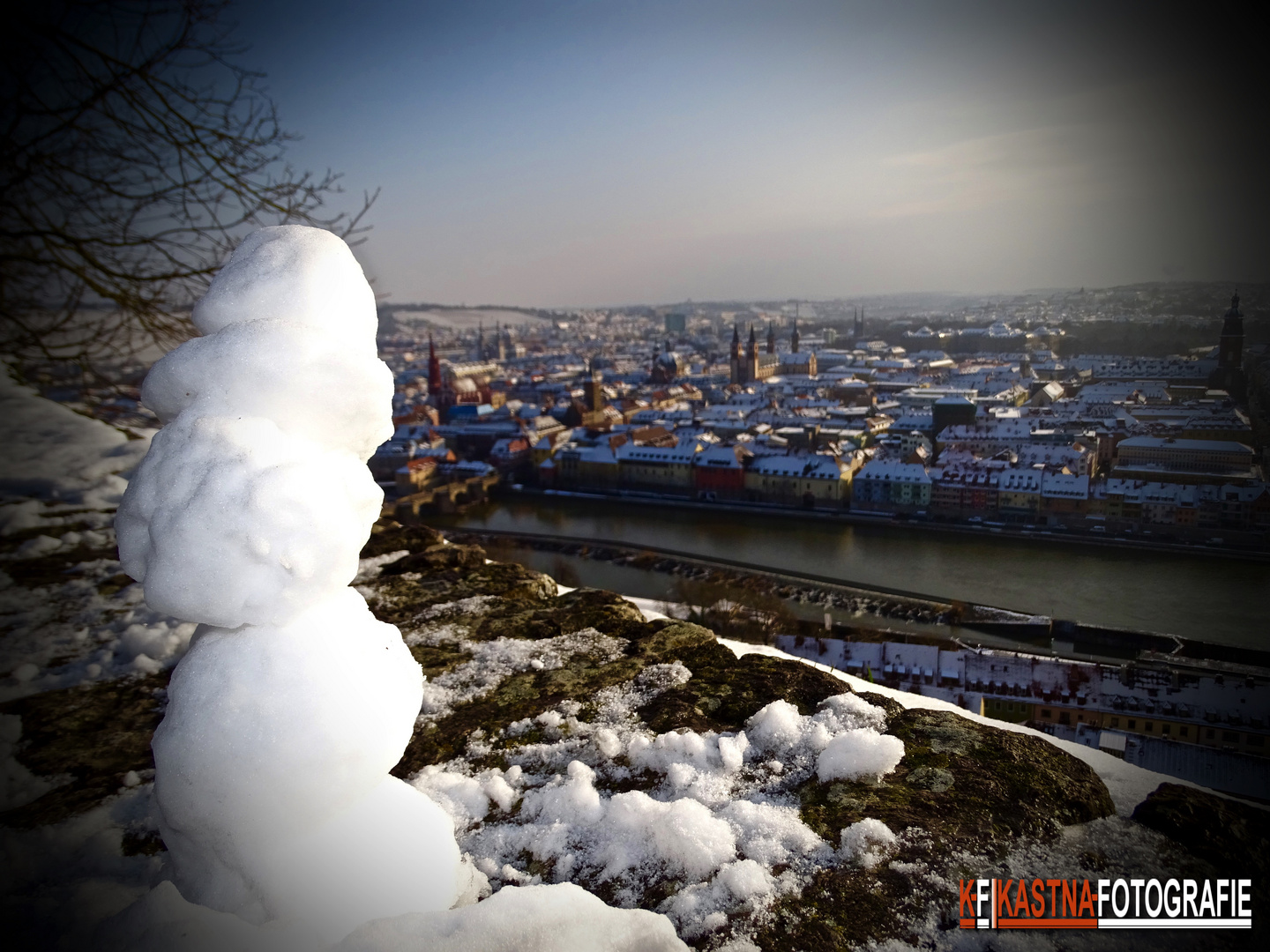 Snowman over the city