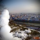 Snowman over the city