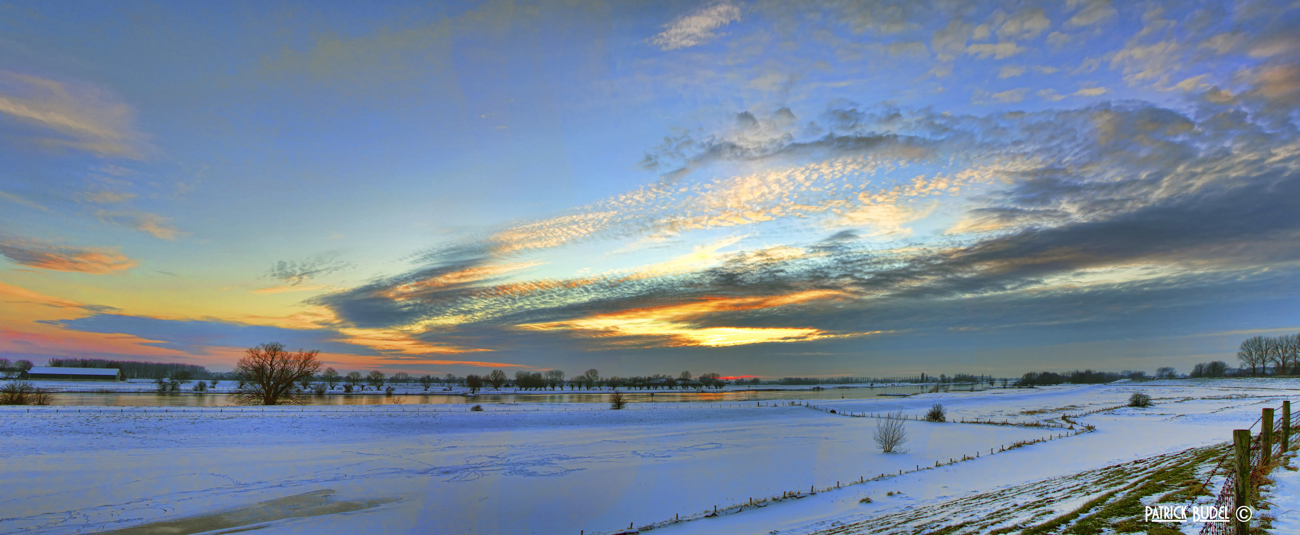 Snowy sunset panorama.