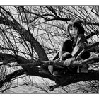 Somerset. 07. Girl in tree by the sea.