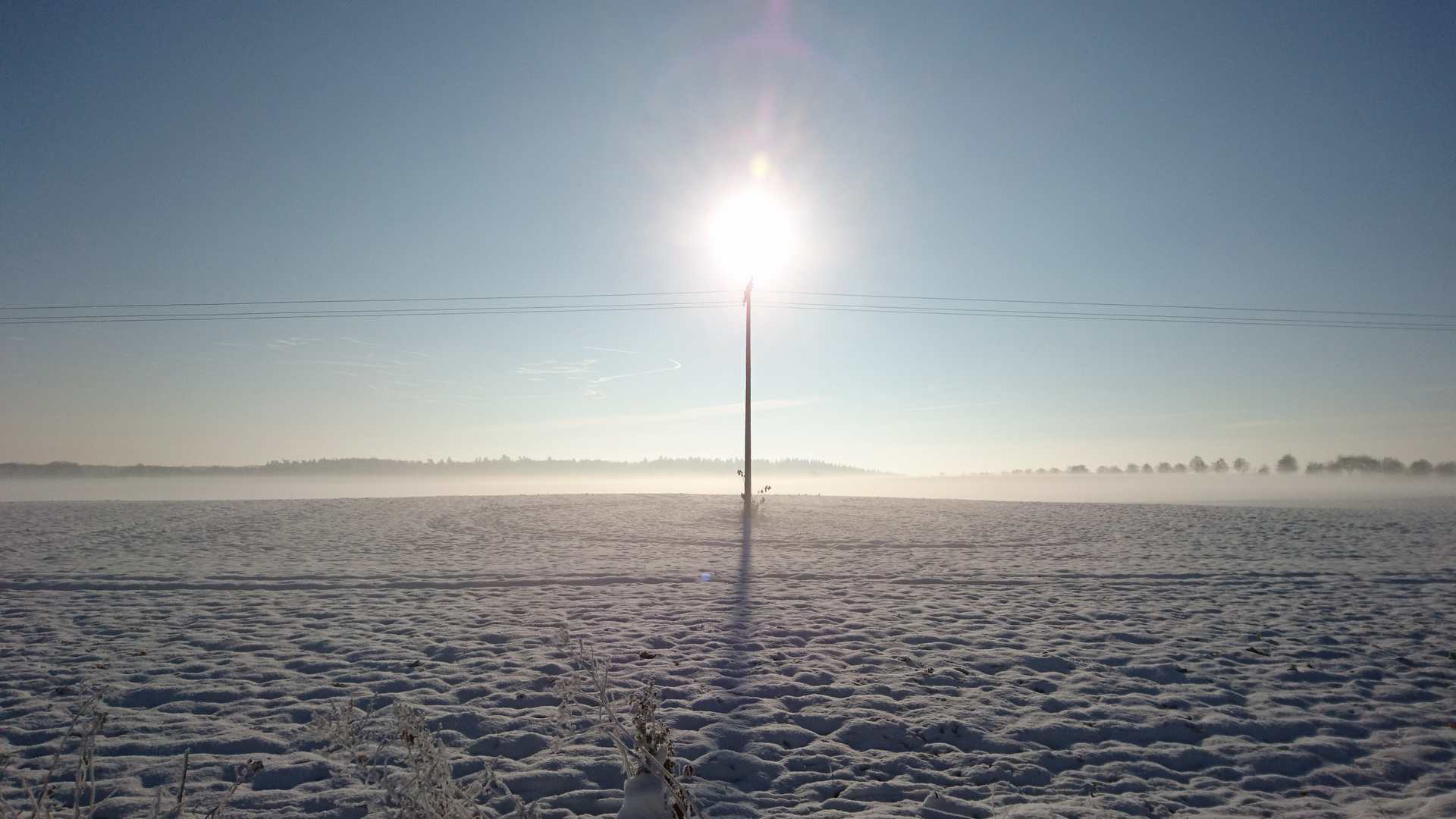 Sonne auf dem Strommast