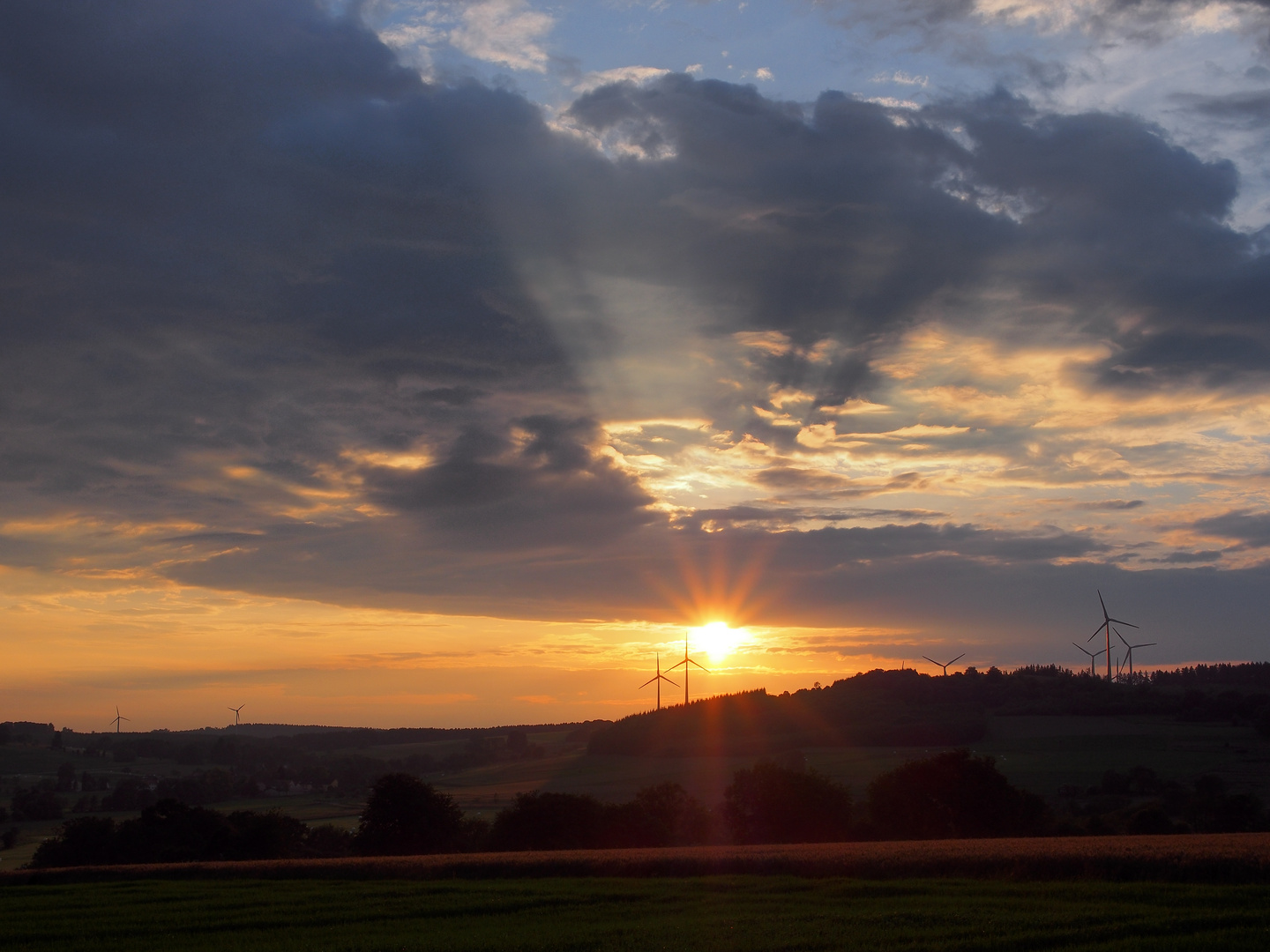 Sonne gegen Windmühlen