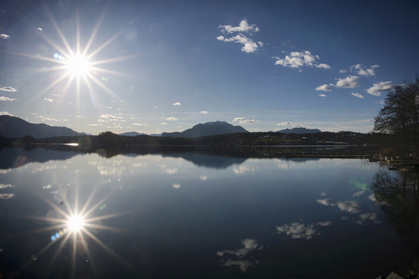 Sonne mit Spiegelung in Egg am Faakersee