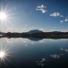 Sonne mit Spiegelung in Egg am Faakersee