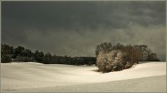 Sonne und Schneewolken