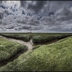 Sonne, Wolken und ein Leuchtturm