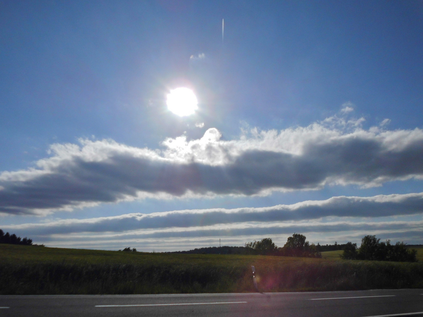 Sonne, Wolken, Wind und Landschaft