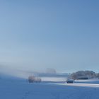 Sonne zieht Winternebel